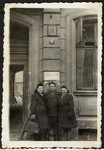 Group portrait of Jewish survivors posing in front of the "kibbutz" on 20 Zachodnia Street in Lodz.
