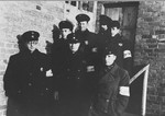 A group of Jewish police poses in front of the ghetto prison.