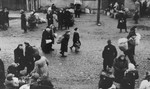 Jews are gathered at an assembly point in the Kovno ghetto during a deportation action [probably to Estonia].