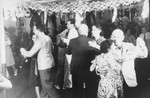 Passengers dancing on board the MS St. Louis.  Rita Goldstein is pictured at the lower right.