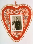 Mother's Day card in the shape of a heart with a photograph of a young boy in the middle.