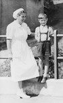 Joel Fabian poses with a nurse at a sanatorium in Davos, Switzerland, where he is recovering from the tuberculosis he contracted while imprisoned in Theresienstadt.
