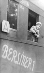 Joel Fabian looks out the window of a train as he leaves Berlin for a sanatorium in Davos, Switzerland, where he will be treated for the tuberculosis he contracted while imprisoned in Theresienstadt..