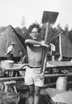 Jacques Rabinovich practices military exercises with a shovel at the Poppendorf displaced persons camp.