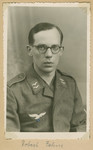 A studio portrait of a Nazi soldier. The name is written as, 'Robert Fahus.'  

(The swastika under the eagle was blacked out with a pen.)