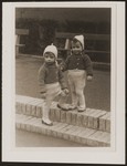 Rene and Renate Guttmann at play in a park.