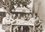 The Schwab family (the donor's maternal grandparents) seated around the table in Mommenheim, France.