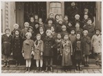 An afternoon Hebrew school class poses in front of the synagogue in Troppau (Opava).
