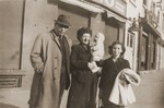 The Rosenbaum family living as non-Jews poses on street corner in Lyon.