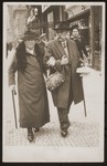 Julius and Fanny Goldstein walk along a street in Tabor, Czechoslovakia.