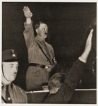 Adolf Hitler salutes his followers at a Nazi Party rally soon after his appointment as Chancellor.