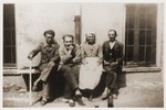 Jakob Rawicz (second from the left) sits outside a barracks in a hospital camp in Aix-en-Provence, where he was transferred from the Les Milles transit camp.