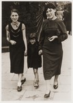 Estera Tenenbaum (left) walks along the streets of Warsaw with her sister, Nechama, and her niece.