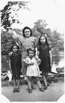A Jewish mother poses in a park in Antwerp with her three daughters.