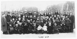 Students and teachers in the Hebrew school in Grabowiec pose for a group photo outside in the snow.