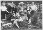 Members of several Jewish families pose in a public garden in Antwerp, Belgium.