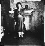 A Jewish woman who is living in hiding as a Christian, poses in the living room of her sister's apartment in Brussels, where her children were sheltered for many months during the German occupation.