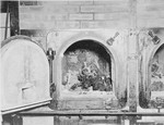 View of a crematoria oven containing the remains of a corpse in Buchenwald concentration camp.
