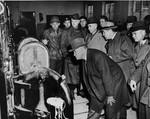 American congressmen view the open ovens in the Buchenwald crematorium during an inspection of the newly liberated concentration camp.