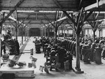 Prisoners at forced labor on the assembly line of the Gustloff Werke II munitions plant in the Buchenwald concentration camp.