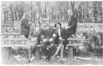 Jewish students pose on a bench at the University of Vilna.
