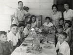 School children sit down for a meal in the Sosua refugee colony.