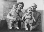 Ernst and Frieda Perl hold their daughters Ellinor (and Evelyn Perl.