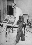A Jewish youth does carpentry work at a hachshara [Zionist collective] operated by the Hashomer Hatzair Zionist youth movement in Piotrkow Trybunalski.