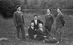 A group of young Jewish men pose in a park in Lithuania.
