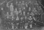 Group portrait of members of the Maccabi sports organization in Visokidbor, Lithuania, taken on the Jewish holiday of Sukkot.