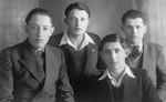 Group portrait of four young Jewish men who were friends of the donor's father, Eliezer Kaplan, from the Zionist movement in Lithuania.
