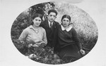 The donor's father, Eliezer Kaplan, poses with a two female friends in Lithuania.