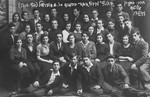 Group portrait of members of the Hehalutz seminar and the kibbutz hachshara, Hasneh, taken on the occasion of the departure of one of their members for Palestine.
