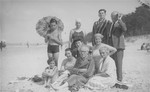 Members of the Bobrow family and friends pose on the beach.