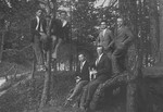A group of young Jewish men pose in a wooded area in Lithuania.