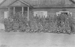 Group portrait of a Lithuanian military unit in front of a house owned by the Gar family in Kron.