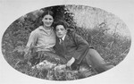 The donor's father, Eliezer Kaplan, poses with a female friend in Lithuania.