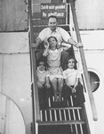 Fritz and Babette Spanier with their twin daughters, Renate and Ines, pose on the steps of the MS St.