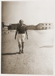Miles Lerman walks along a road in the Schlachtensee displaced persons camp.