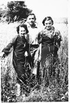 Faigel Lazebnik poses in a field near her home with two friends.