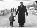 Esther Almer walks down the Promenade des Anglais in Nice holding her father's hand.