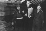 Two military policeman escort Nuremberg SS Lieutenant General Ernst Kaltenbrunner.