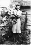 Faigel holds her nephew Schelemale, the son of her older brother Moishe.