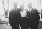 During a temporary leave from the Les Milles internment camp, Baruch Brenig (right) poses with his son,Theo (center), and brother-in-law, Hermann Herzmann (left), at the Vieux Port in Marseilles.