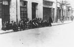 On June 29, 1941, Jews arrested by Romanian soldiers and police wait on a street in Iasi before being sent to police headquarters.