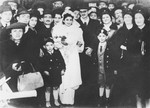 Group portrait of members of a Jewish wedding party in Bucharest.