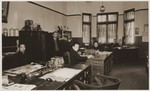 Staff members at work in the offices of the International Committee for European Immigrants in China.