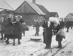 Residents of the ghetto move to new housing after the Germans reduced the borders of the Kovno ghetto.