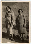Two Macedonian Jewish friends pose for a photograph in the courtyard.