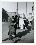 A black marketeer stands on a street corner in Vienna,